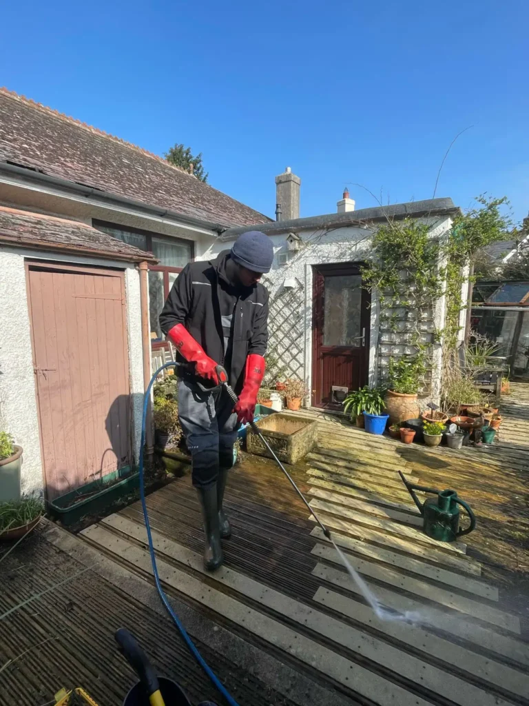 Jet washing decking in Cornwall after clearing blocked drains.